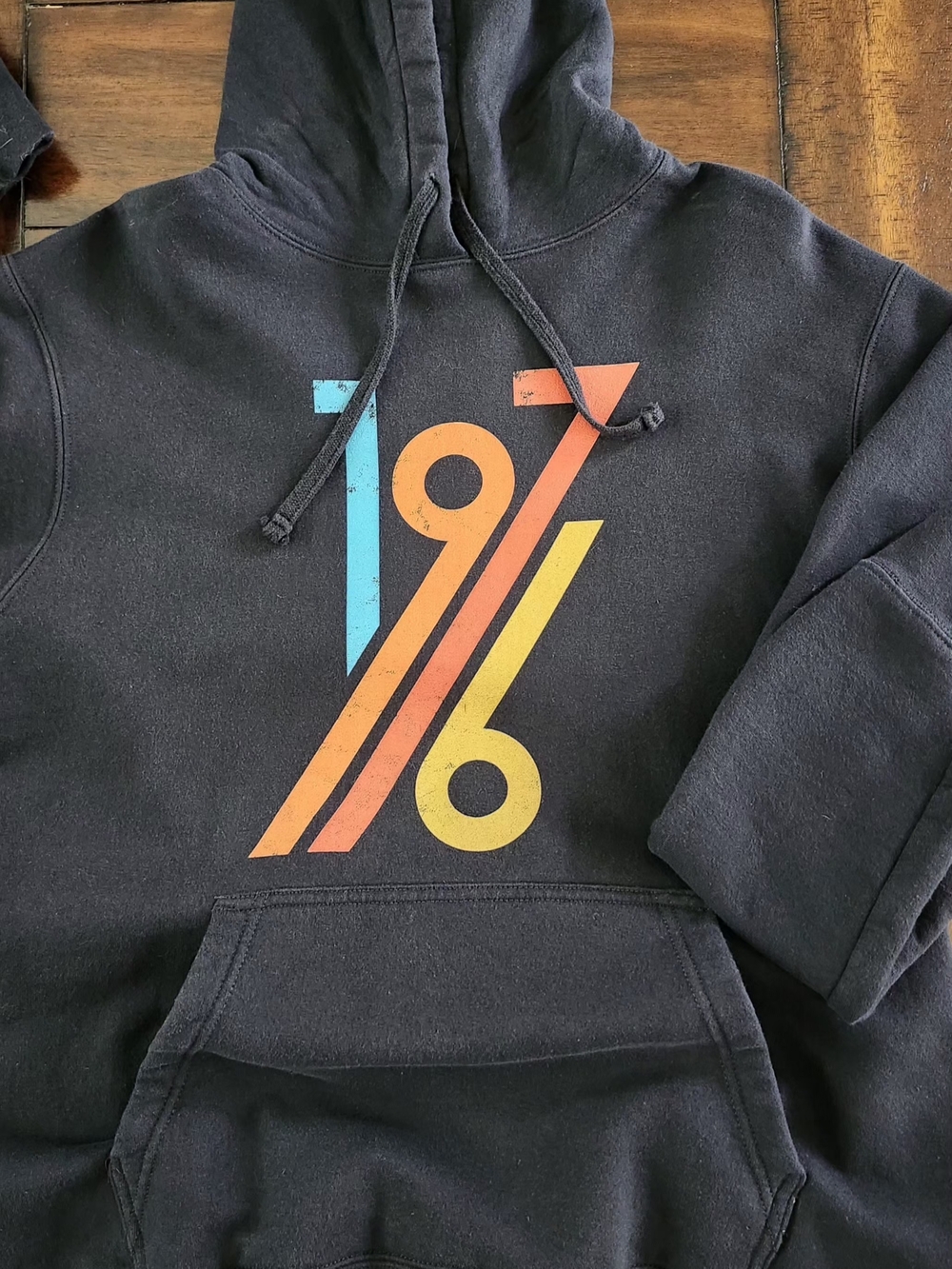 Port and Company Black Hoodie with Retro 1976 Graphic in Blue, Orange & Yellow